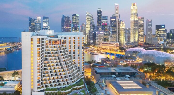 View of the Mandarin Oriental hotel in Singapore, showcasing its proximity to the central business district and waterfront, ideal for visitors to the Singapore Grand Prix.