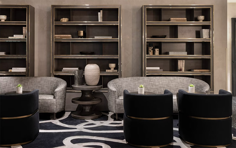 Luxurious lounge area at The Ritz-Carlton, South Beach, featuring elegant furniture and stylish shelves, ideal for Club World Cup Hotel Packages in Miami.
