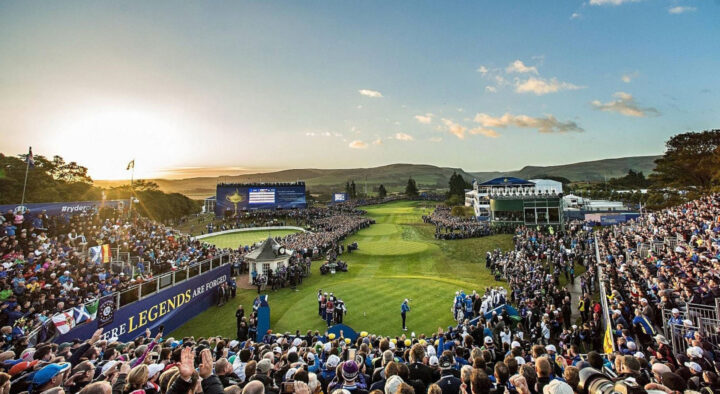 Sunset over a crowded Ryder Cup event at a golf course, highlighting popular sports activities in New York.