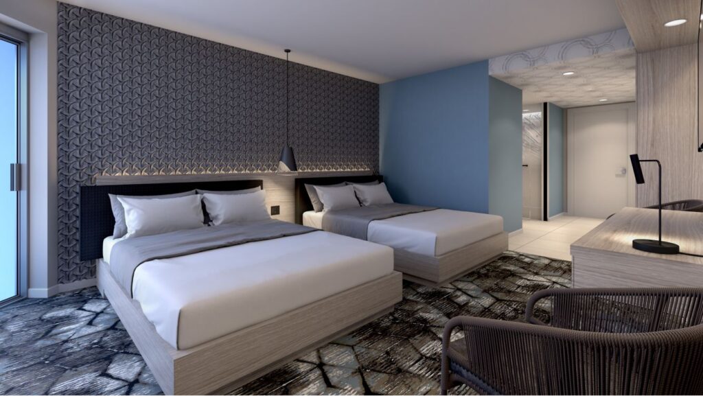 Luxury double queen room at Renaissance Daytona Beach Oceanfront Hotel, featuring stylish decor, ample lighting, and modern amenities, ideal for Daytona Beach hotels and accommodations.