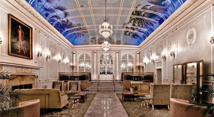 Luxurious hotel lobby in Montreal featuring elegant furnishings, striking chandeliers, and classical decor, highlighting accommodations for the Canadian Grand Prix in Montreal.