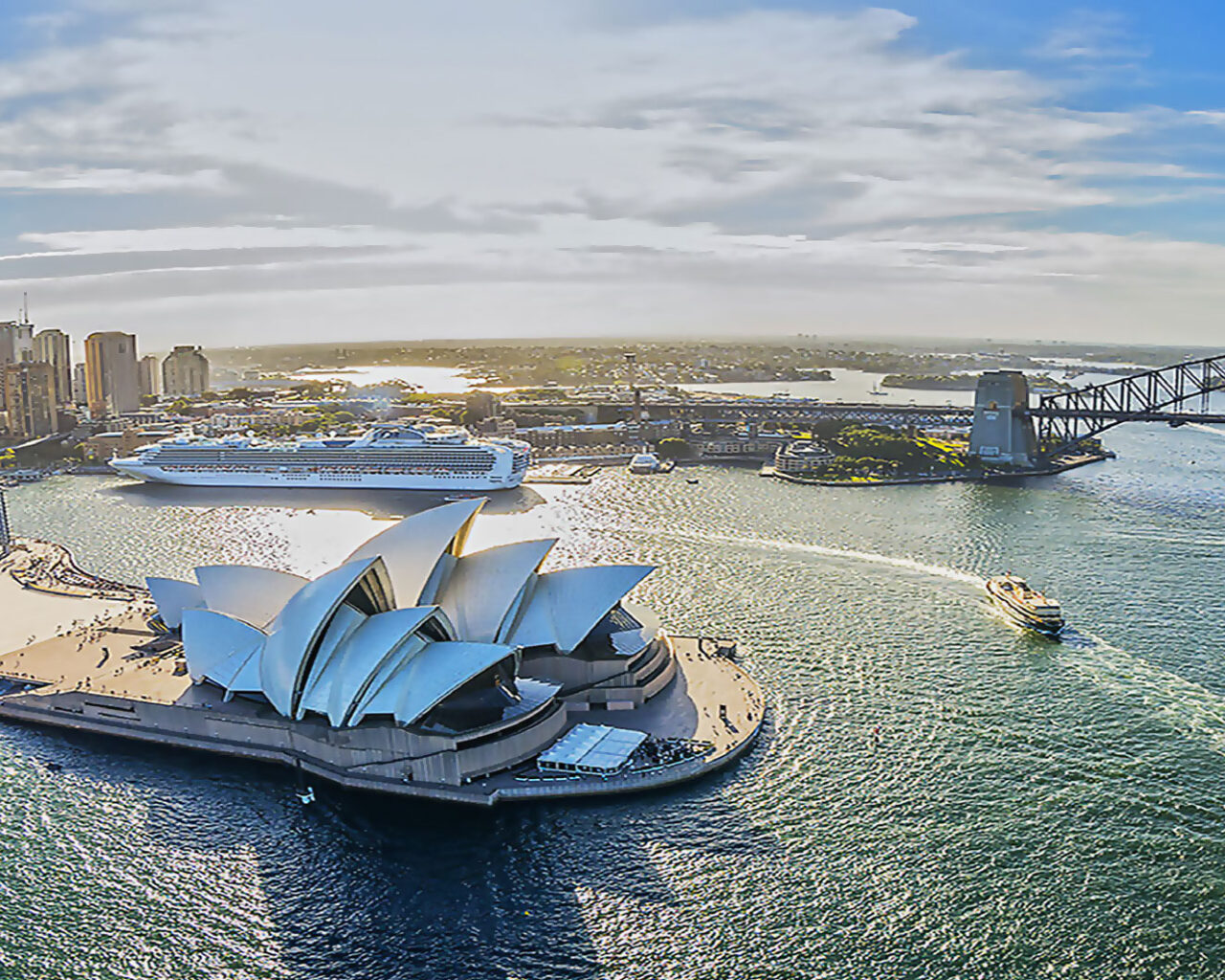 Aerial view of Sydney Harbour featuring the iconic Sydney Opera House and Harbour Bridge, perfect for visitors planning to attend the Custom World Cup of Rugby in Australia.