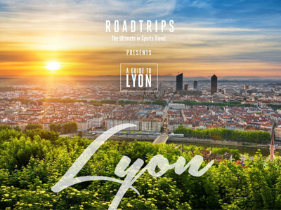 A scenic sunset over Lyon with the text 'Roadtrips - The Ultimate in Sports Travel presents A Guide to Lyon,' promoting luxury travel guides for sporting events.