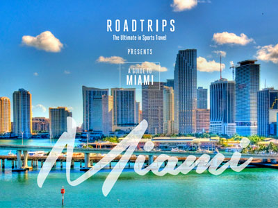 Luxury travel guide by Roadtrips featuring a scenic view of Miami's skyline and waterways, promoting their guide to the city for sports and travel enthusiasts.