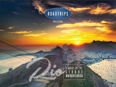 Sunset over Rio de Janeiro with iconic mountain views and busy beaches, featured in a luxury travel guide by Roadtrips for exploring the city.
